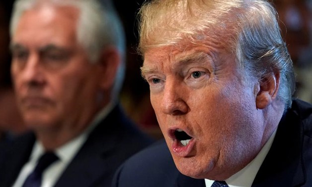 Secretary of State Rex Tillerson (L) sits beside U.S. President Donald Trump during a cabinet meeting at the White House in Washington, U.S., November 1, 2017. REUTERS/Kevin Lamarque
