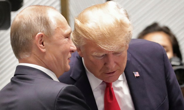 U.S. President Donald Trump and Russian President Vladimir Putin talk before a session of the APEC summit in Danang, Vietnam November 11, 2017. Sputnik/Mikhail Klimentyev/Kremlin via REUTERS