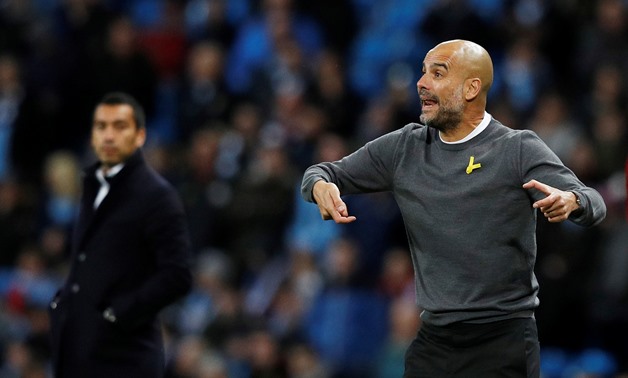 Champions League - Manchester City vs Feyenoord - Etihad Stadium, Manchester, Britain - November 21, 2017 Manchester City manager Pep Guardiola and Feyenoord coach Giovanni van Bronckhorst REUTERS/Phil Noble