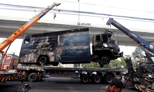 A police prison van, destroyed during clashes, is cleared from the road a day after the Tehreek-e-Labaik Pakistan Islamist political party called off nationwide protests in Islamabad, Pakistan November 28, 2017. REUTERS/Faisal Mahmood

