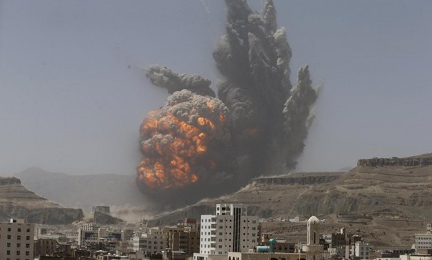 Smoke rises during an air strike on an army weapons depot on a mountain overlooking Sanaa, April 20, 2015. REUTERS/Khaled Abdullah. 