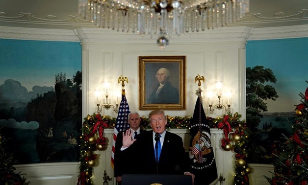 U.S. President Donald Trump, flanked by ‪Vice President Mike Pence‬, delivers remarks recognizing Jerusalem as the capital of Israel at the White House in Washington, U.S. December 6, 2017. REUTERS/Jonathan Ernst