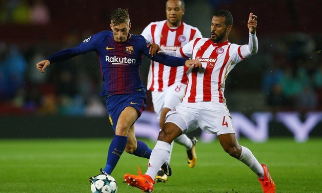 Soccer Football - Champions League - FC Barcelona vs Olympiacos - Camp Nou, Barcelona, Spain - October 18, 2017 Barcelona’s Gerard Deulofeu in action with Olympiacos' Alaixys Romao REUTERS/Ivan Alvarado