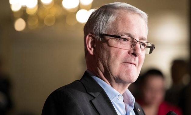 The Honourable Marc Garneau, Minister of Transport, speaks to the media while he and his cabinet take part in a two-day Liberal retreat in Calgary, Alberta, Canada January 24, 2017. REUTERS/Chris Bolin