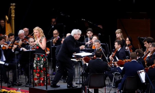 Liverpool-born maestro, now 63, Sir Simon Rattle conducts at the Berliner Waldbuehne his final concert at the helm of the Berlin Philharmonic after 16 years in Berlin, Germany, June 24, 2018. REUTERS/Michele Tantussi.
