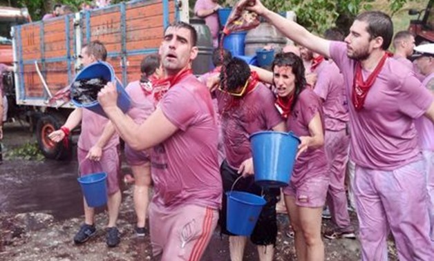 Revellers have wine poured over them during the Batalla de Vino (Wine Battle) in Haro, Spain, June 29, 2018. REUTERS/Vincent West
