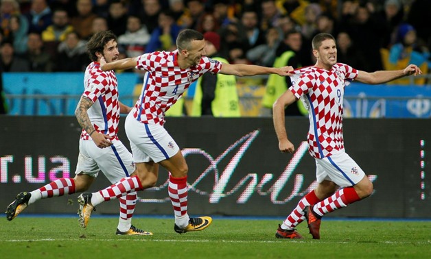 roatia's Andrej Kramaric celebrates scoring their first goal with team mates REUTERS/Valentyn Ogirenko