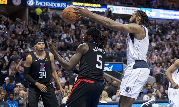 Dec 2, 2018; Dallas, TX, USA; Dallas Mavericks center DeAndre Jordan (6) grabs a rebound over LA Clippers forward Montrezl Harrell (5) during the second quarter at the American Airlines Center. Mandatory Credit: Jerome Miron-USA TODAY Sports
