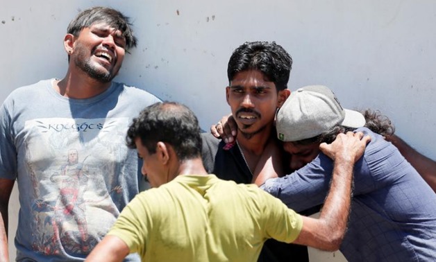 Relatives of a victim of the explosion at St. Anthony's Shrine, Kochchikade church react at the police mortuary in Colombo, Sri Lanka April 21, 2019. REUTERS/Dinuka Liyanawatte
