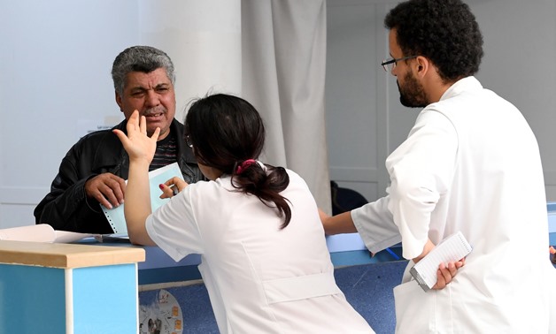 A Tunisian patient arrives at the emergency room of the Charles Nicole Hospital in Tunis - AFP PHOTO / FETHI BELAID