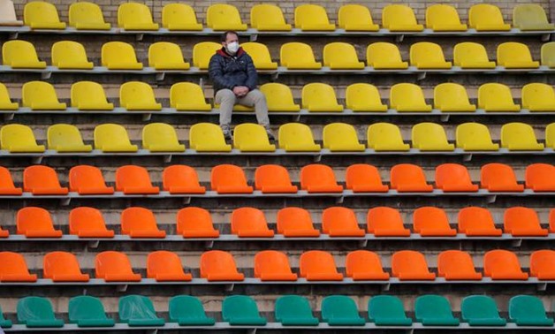 Soccer Football - Vysheyshaya Liga - FC Neman v Belshina - Stadyen Neman, Grodno, Belarus, April 10, 2020 A fan in the stands despite most sport being cancelled around the world as the spread of coronavirus disease (COVID-19) continues REUTERS/Vasily Fedo