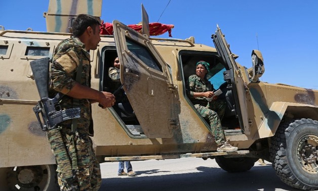 Syrian Democratic Forces (SDF) on the outskirts of Raqa -
 AFP/DELIL SOULEIMAN