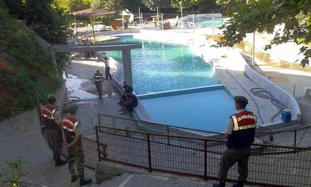 Turkish paramilitary police officers investigate the deaths of five people at a water park in Akyazı. Photograph: AP