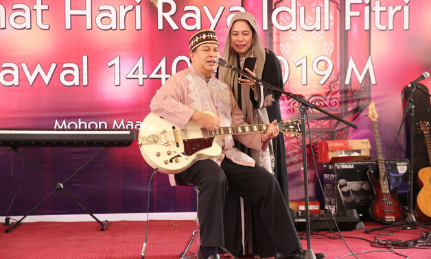 Indonesian Ambassador to Egypt and his wife, Mrs Latifa, perform a musical show during the celebration of Eid alFitr at the embassy- press photo