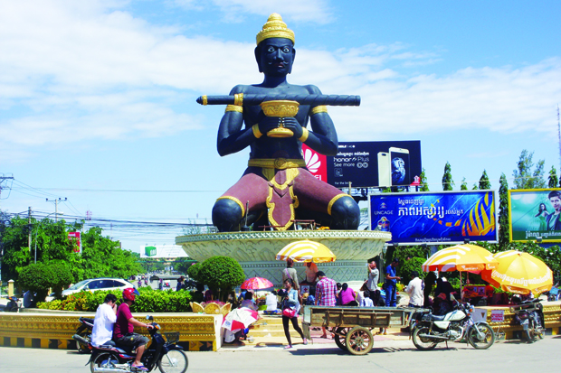 A large statue in Battambang of Ta Dambong, a farmer who found a magic stick and used it to usurp the king. 