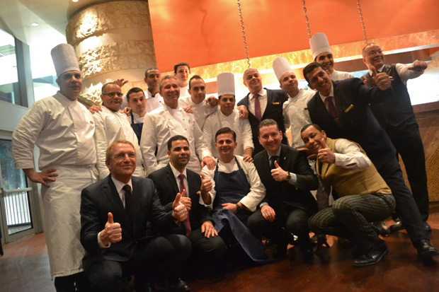 Chef Oliver Glowig (top row, fifth from left) and the team at the Nile Ritz-Carlton.