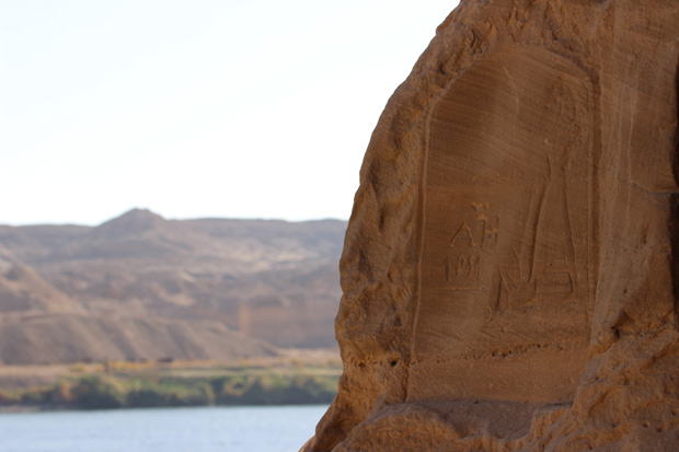 Stele with modern graffiti near the river.