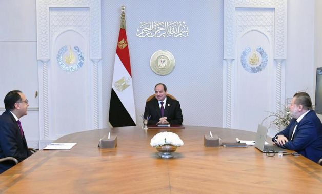 President Sisi meets PM Madbouly, CBE Governor Hassan Abdallah